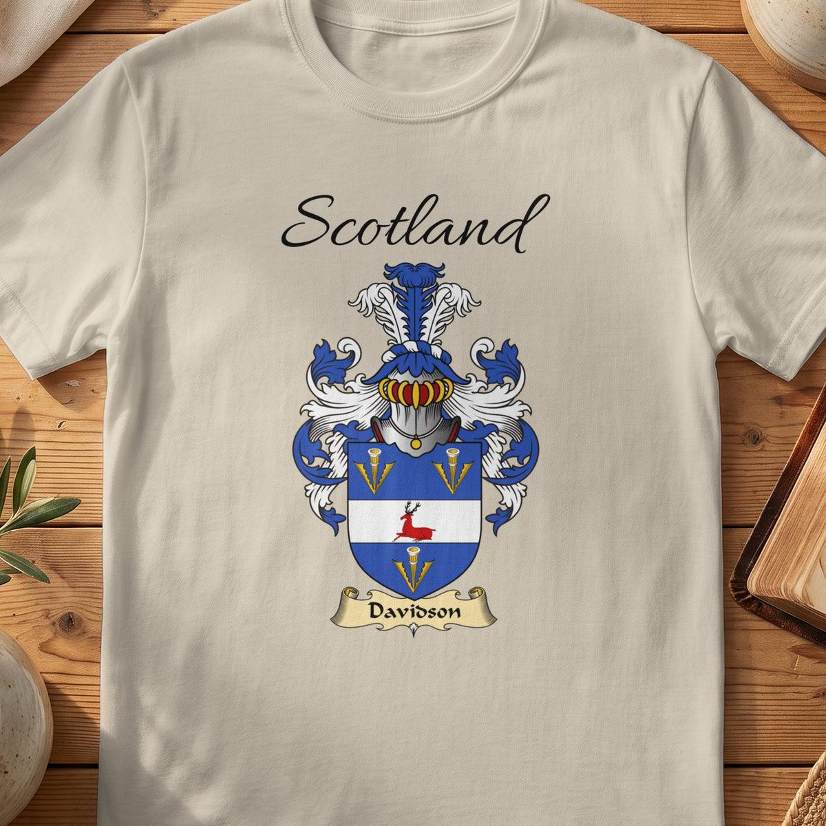 Sand Davidson Scottish family shield T-shirt featuring a blue shield with gold motifs and a white band