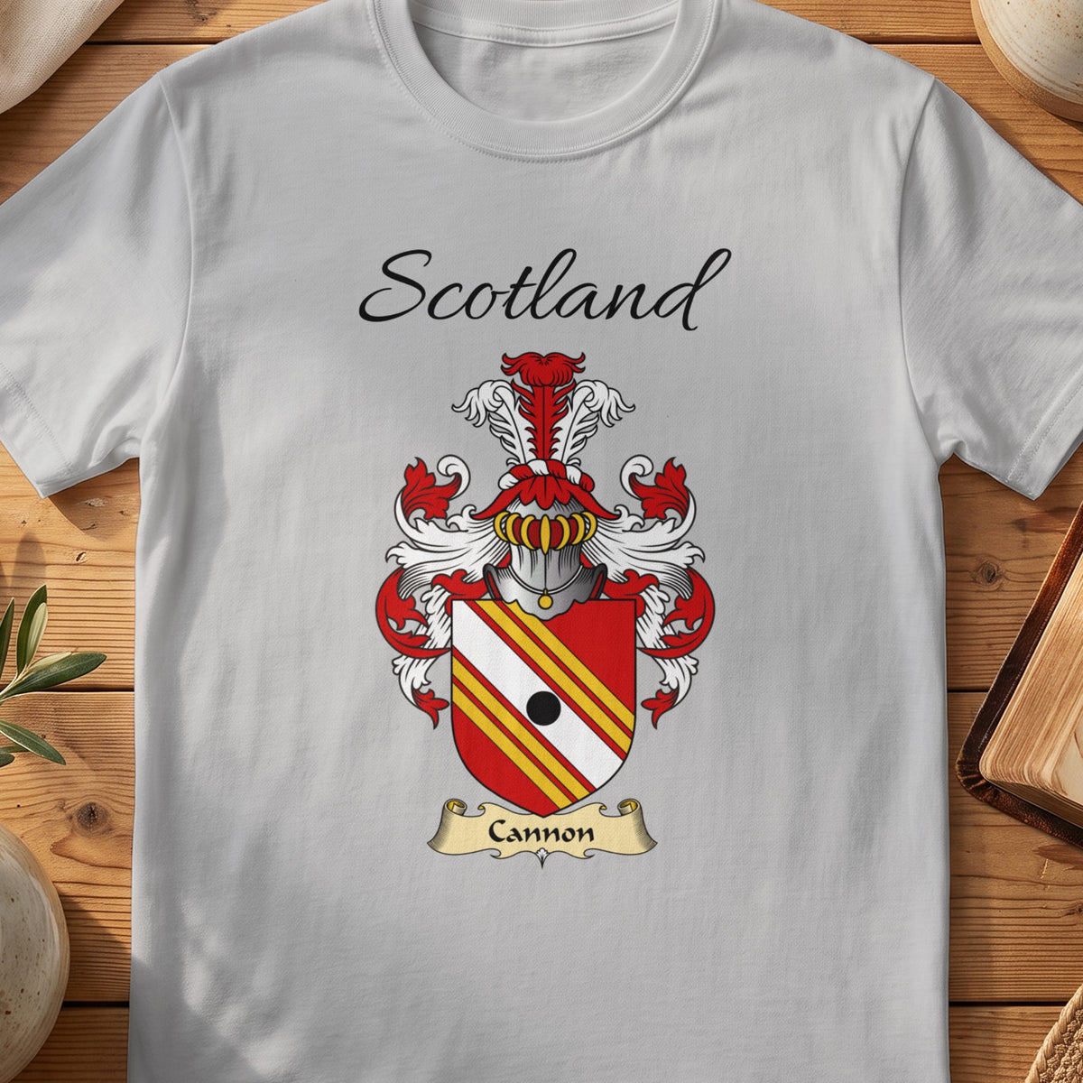 Sport Grey Cannon Scottish family shield T-shirt featuring red-and-gold diagonal stripes with a black roundel