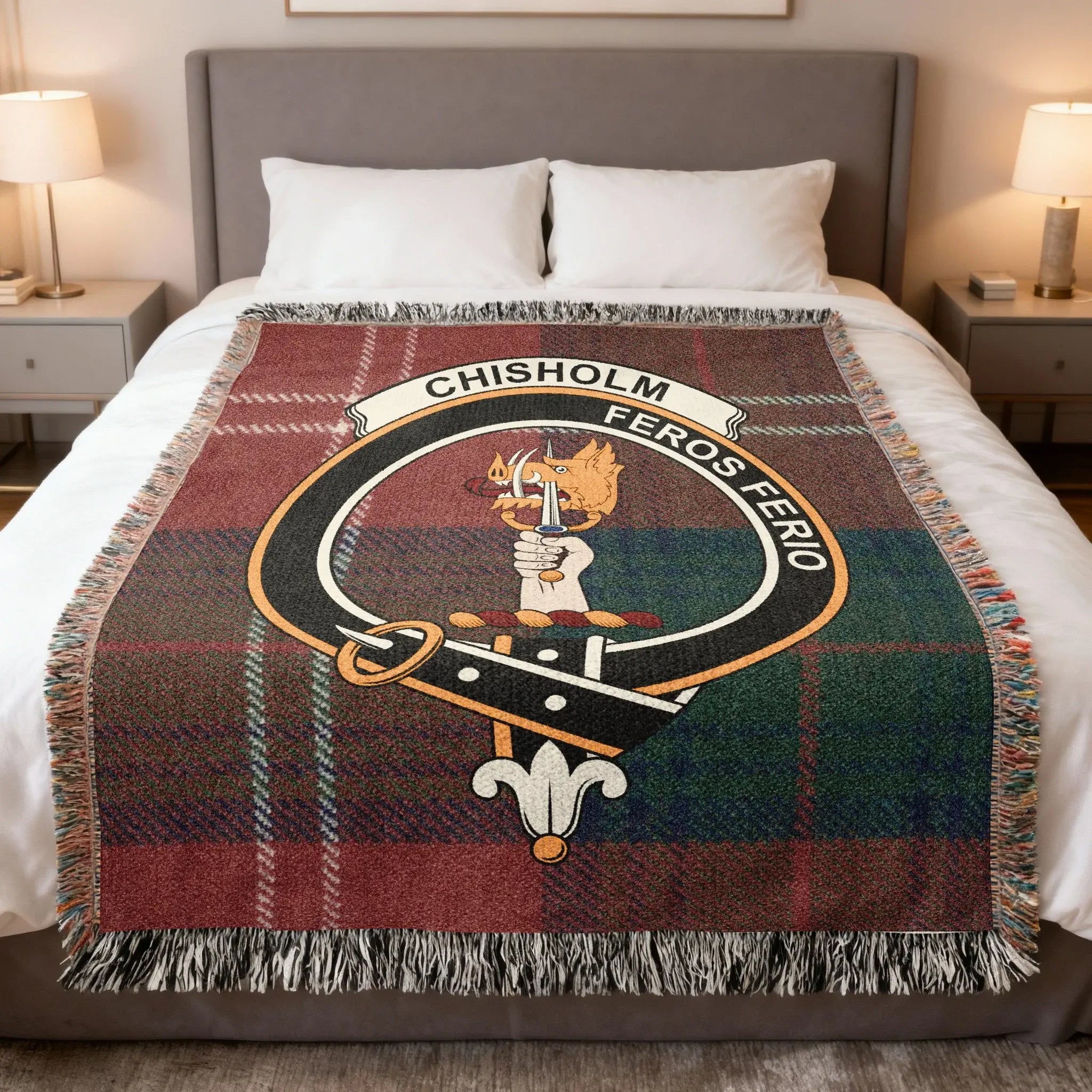 Chisholm clan tartan woven blanket on sofa — 100% cotton with green-red plaid and clan crest