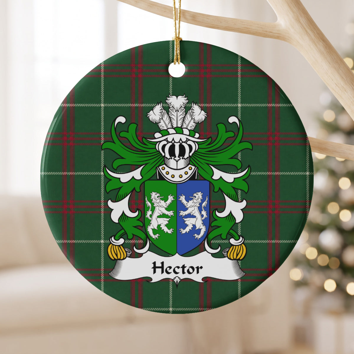 Hector ornament hanging from a pale wooden branch; two facing white lions on a green-and-blue divided shield on Welsh national tartan.