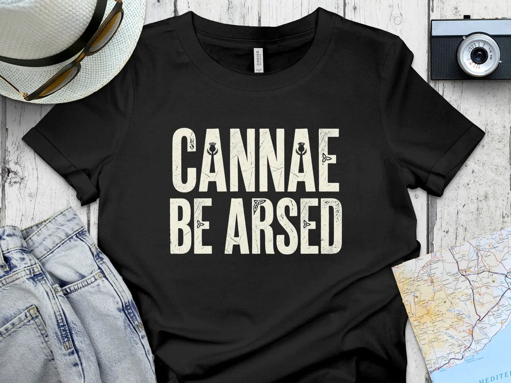 Black t-shirt with "CANNAE BE ARSED" text, styled with distressed lettering.