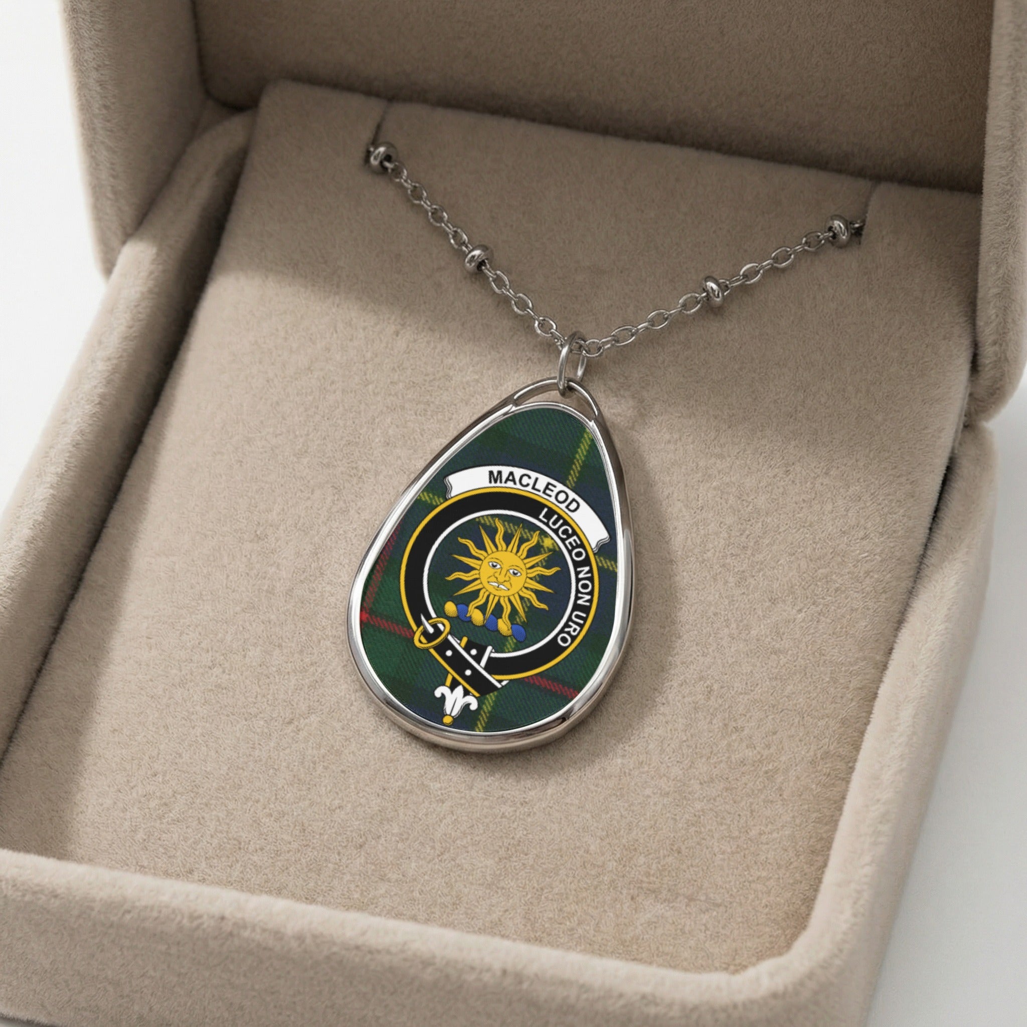 Pendant necklace with Macleod clan crest on tartan background in a jewelry box