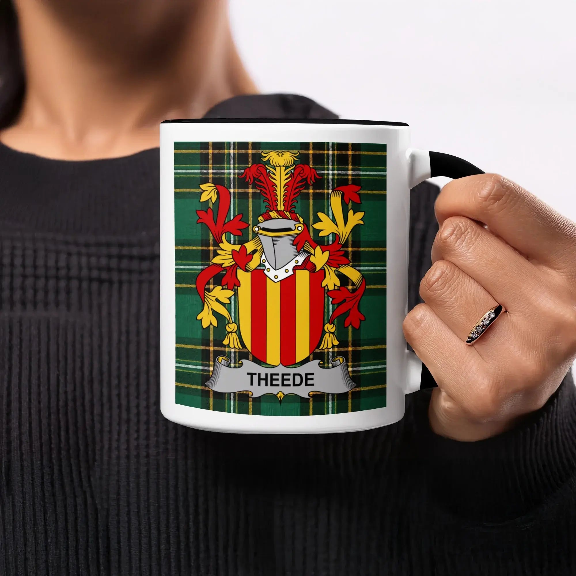 Mug with green plaid and a family crest with the name "THEEDE".