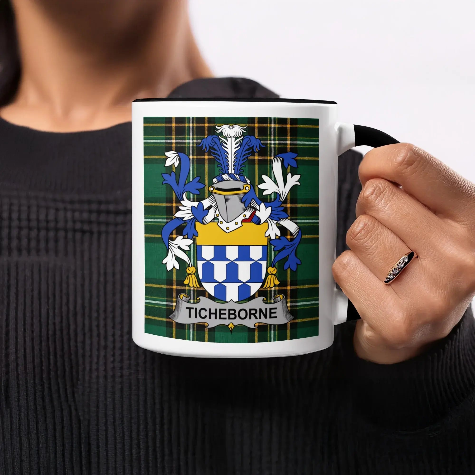 White mug with black rim and handle featuring a tartan pattern and the TICHBORNE coat of arms.