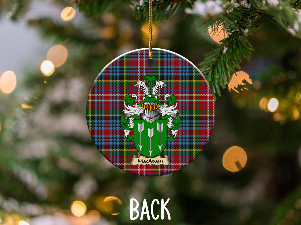 MacAdam ceramic ornament detail showing a double-sided family shield on a Caledonia tartan background