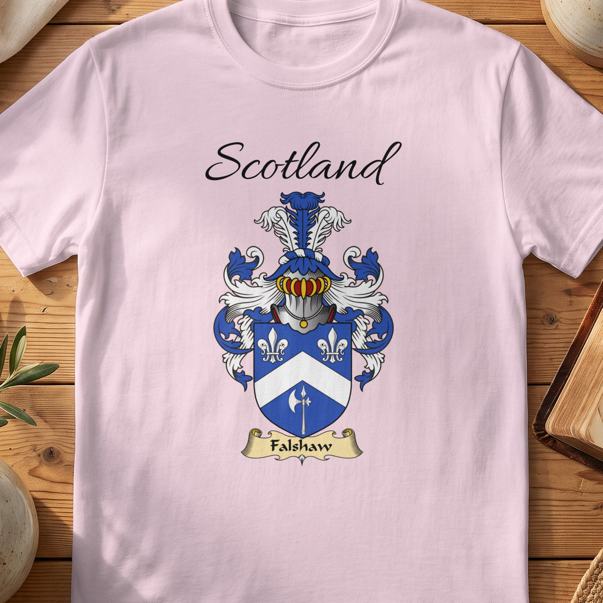 Light Pink Falshaw Scottish family shield T-shirt featuring a white chevron and floral motifs on blue