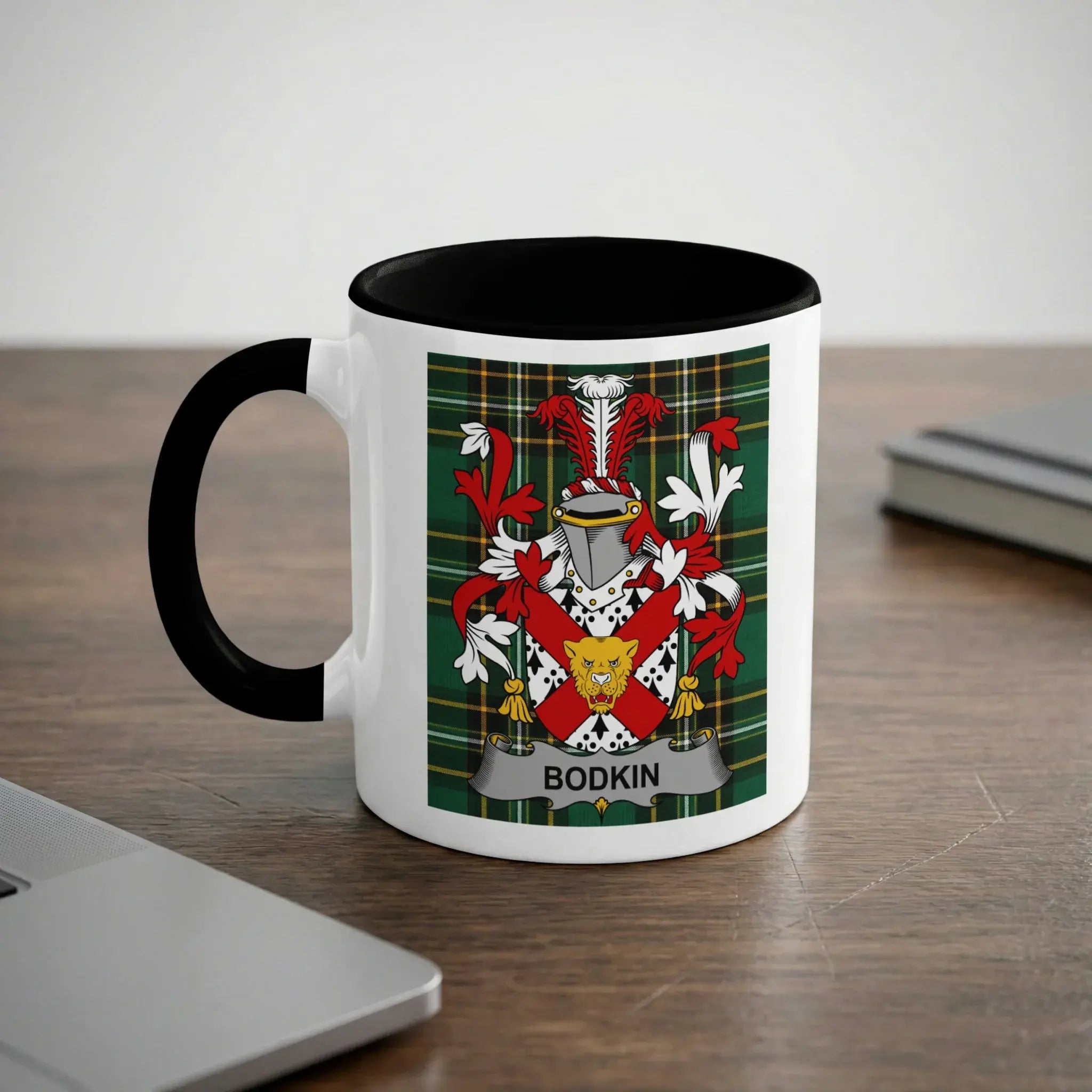 White mug with black rim, displaying a green tartan crest with "BODKIN" banner.