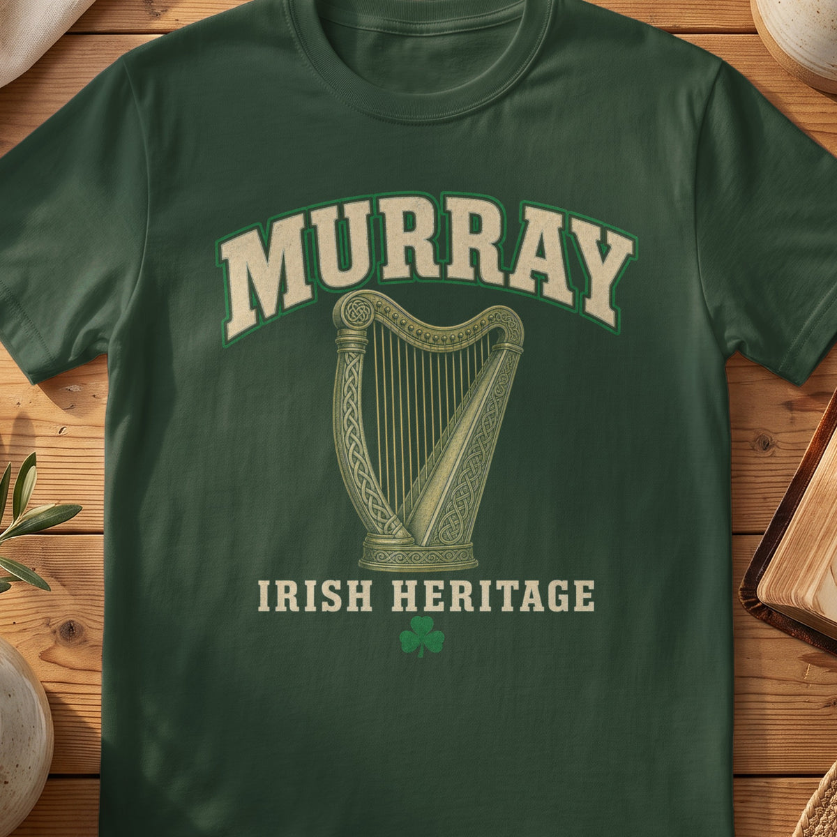 Murray Irish harp T-shirt in Forest Green, with cream surname lettering, a gold-toned harp, green shamrock and “Irish Heritage” text.