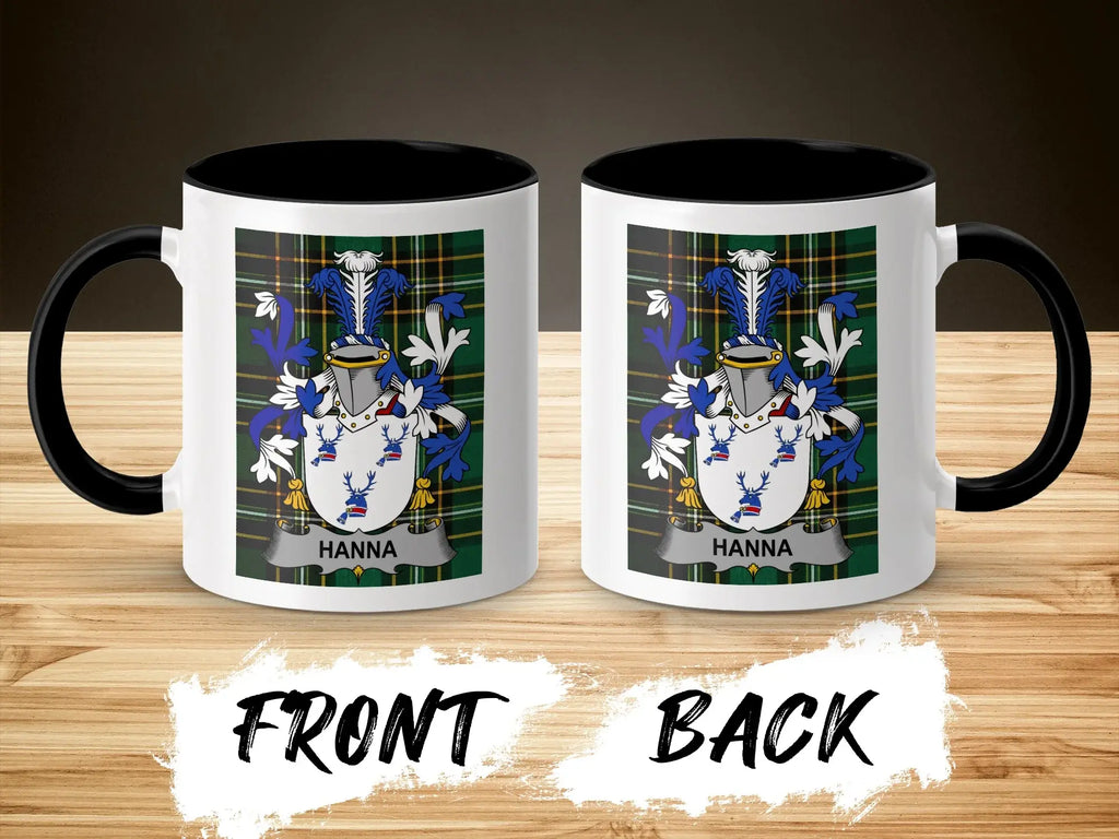 Two white ceramic mugs with black rims and handles, displaying a coat of arms and the name "HANNA".