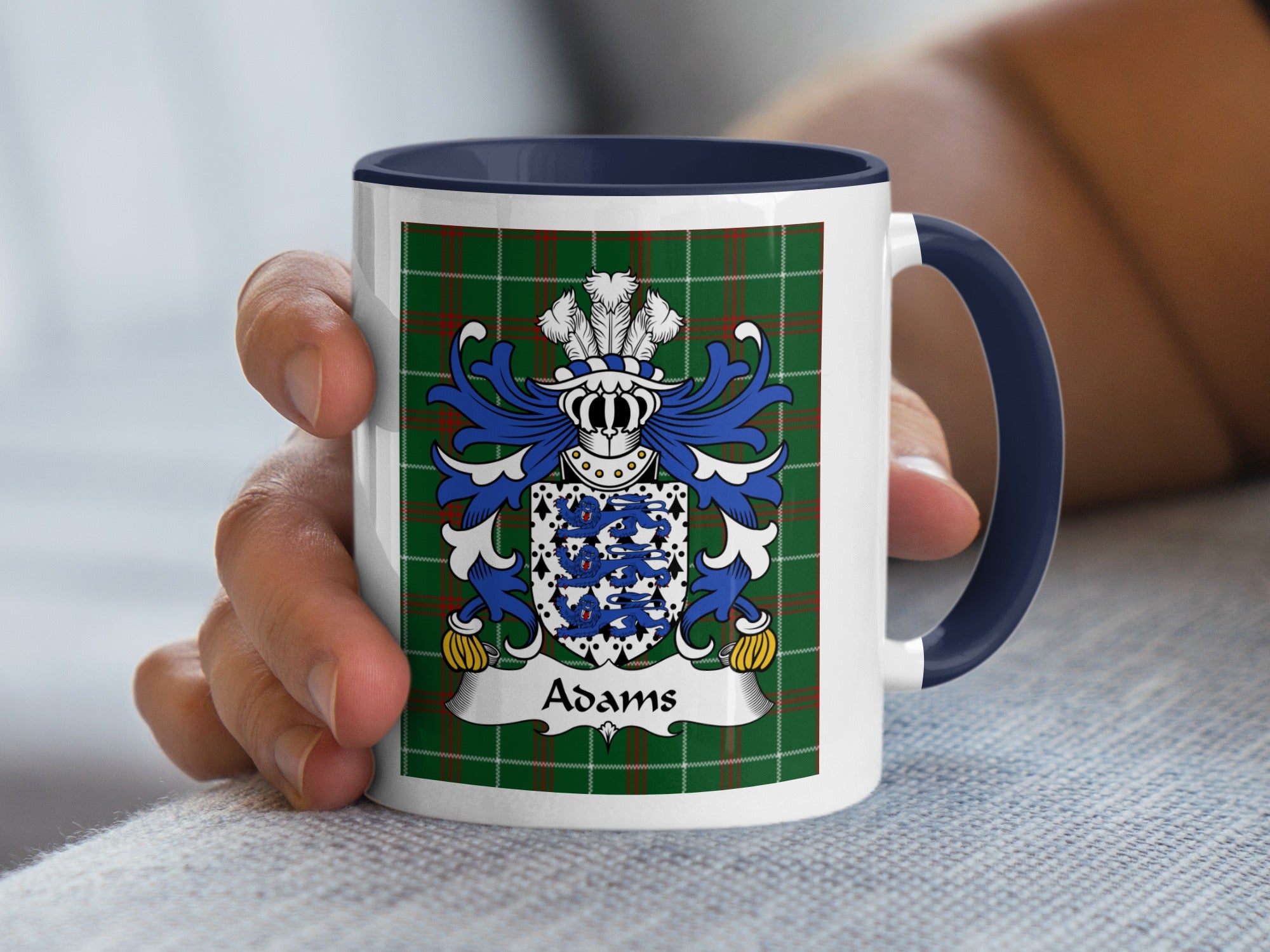 Mug featuring the Adams coat of arms on a green plaid background.