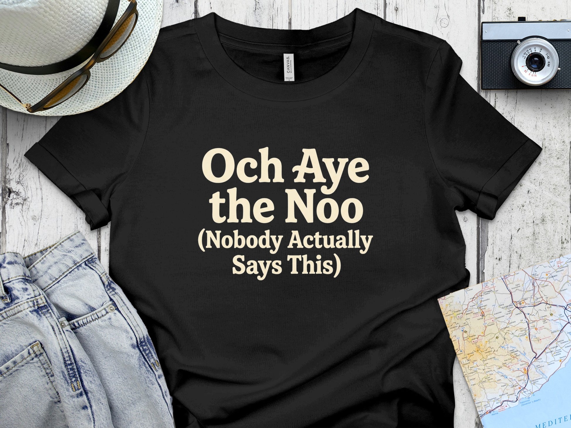 Black t-shirt with text "Och Aye the Noo (Nobody Actually Says This)".