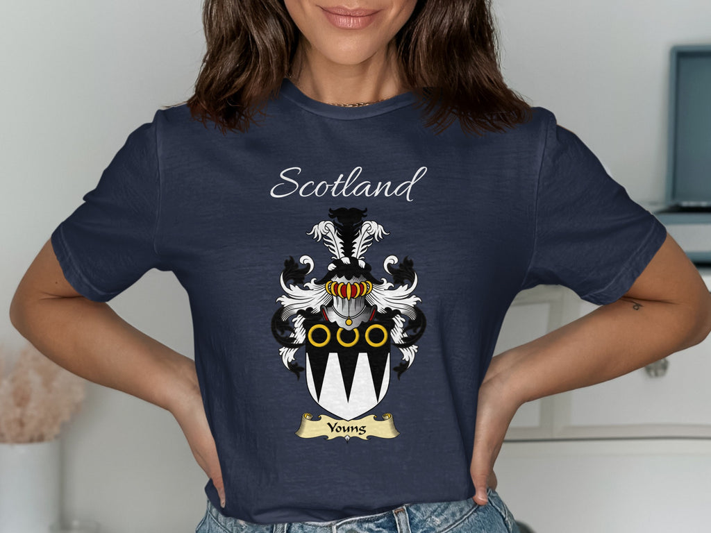 Model wearing the navy Youngs family crest T-shirt featuring “Scotland” and the surname banner.