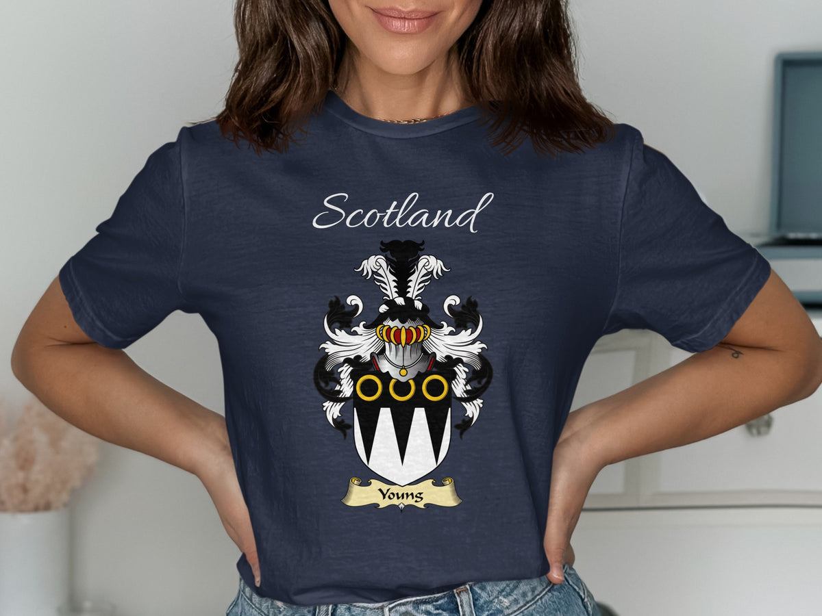 Model wearing the navy Youngs family crest T-shirt featuring “Scotland” and the surname banner.