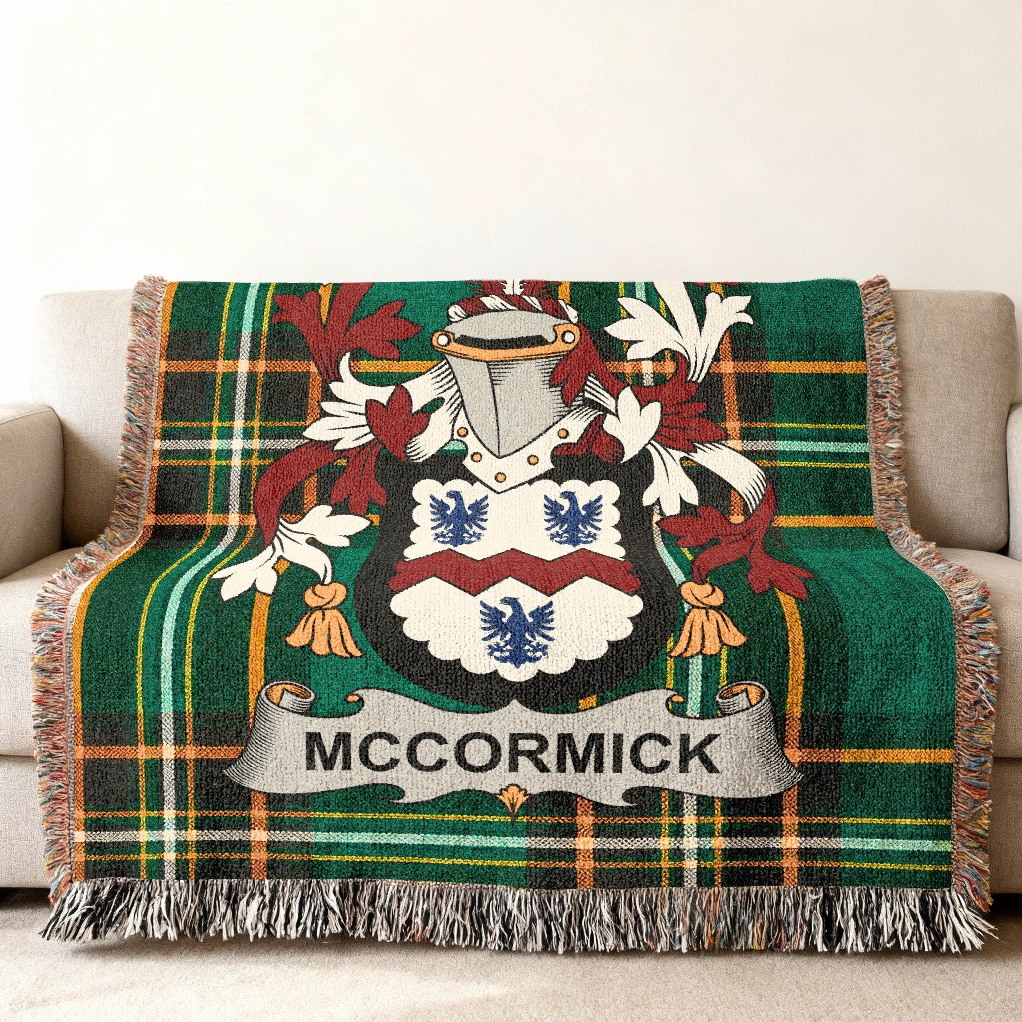 McCormick family crest woven blanket held up to show the Irish tartan design.
