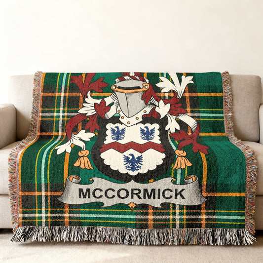 Woven throw blanket featuring the McCormick family crest and tartan pattern.