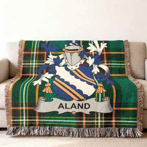 Aland family emblem woven into a green Irish National Tartan blanket