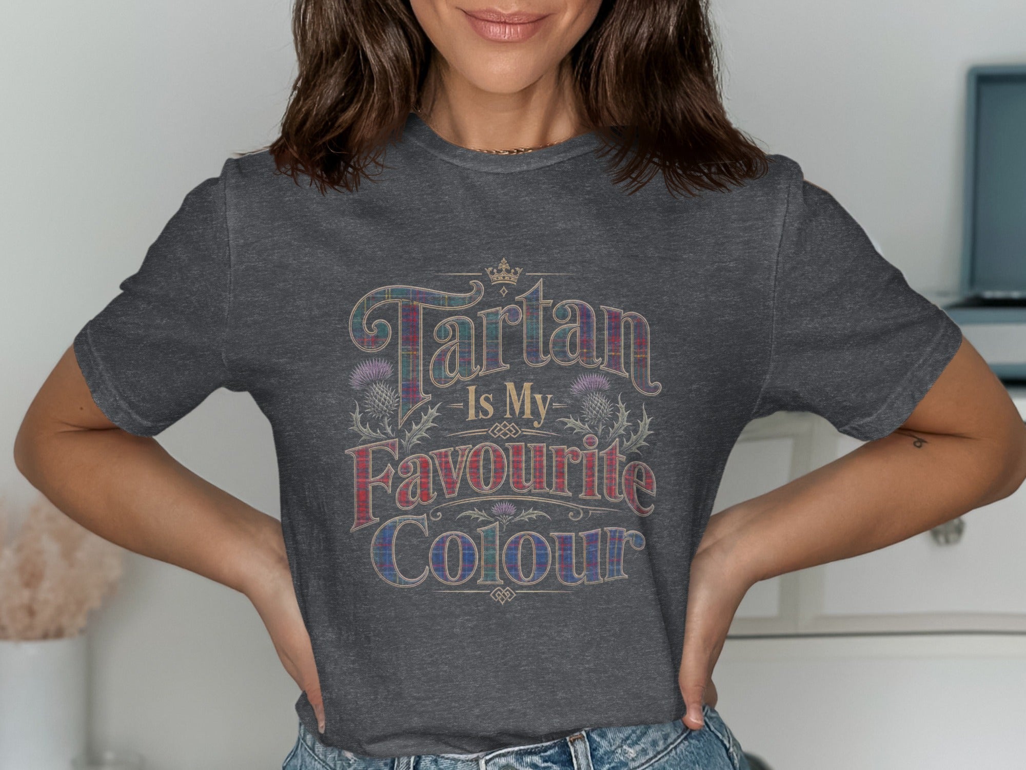 Tartan Is My Favourite Colour text with tartan pattern and thistle illustrations on a dark grey t-shirt.