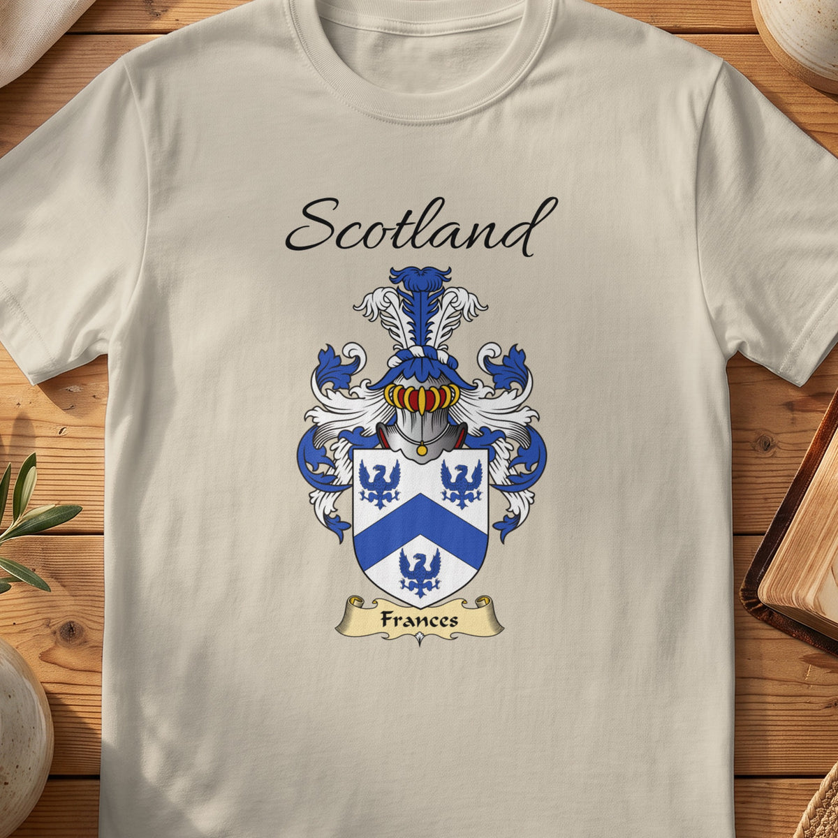 Sand Frances Scottish family shield T-shirt featuring blue birds around a blue chevron