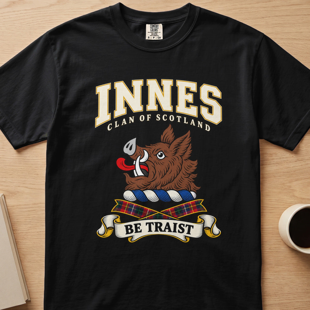 Innes clan crest with brown boar head on a black Comfort Colors T-shirt, front view