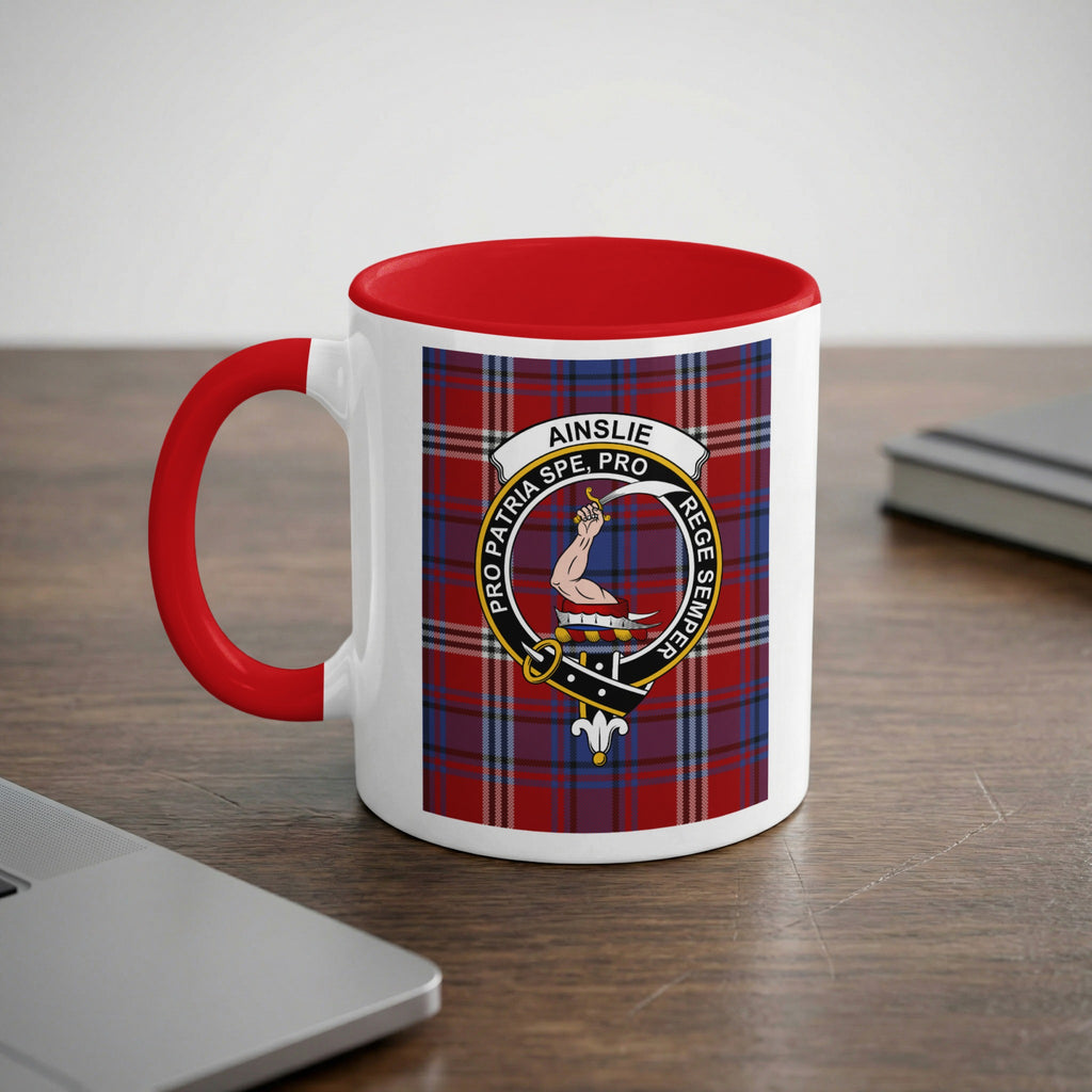 Ainslie Scottish family crest artwork on an 11 oz red accent mug with a tartan background