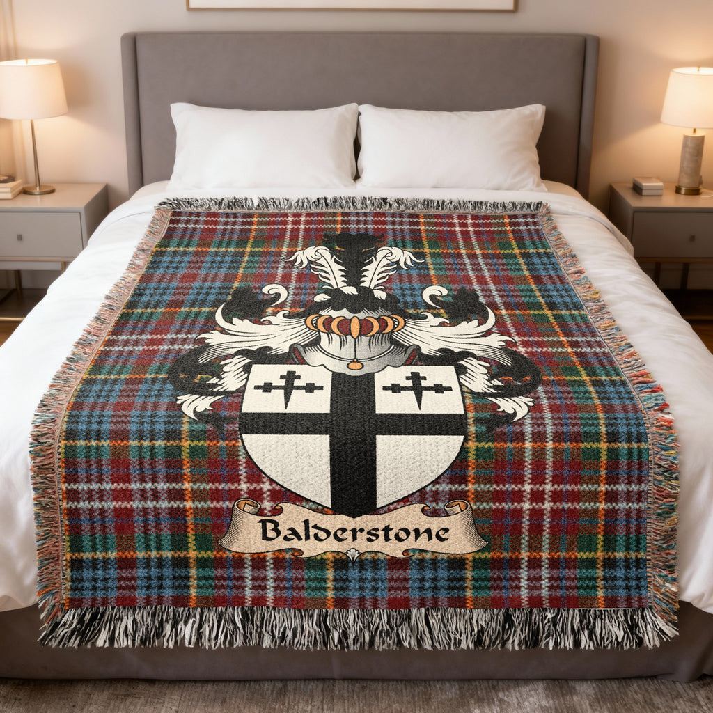 Balderstone family crest emblem on a Caledonia tartan woven blanket