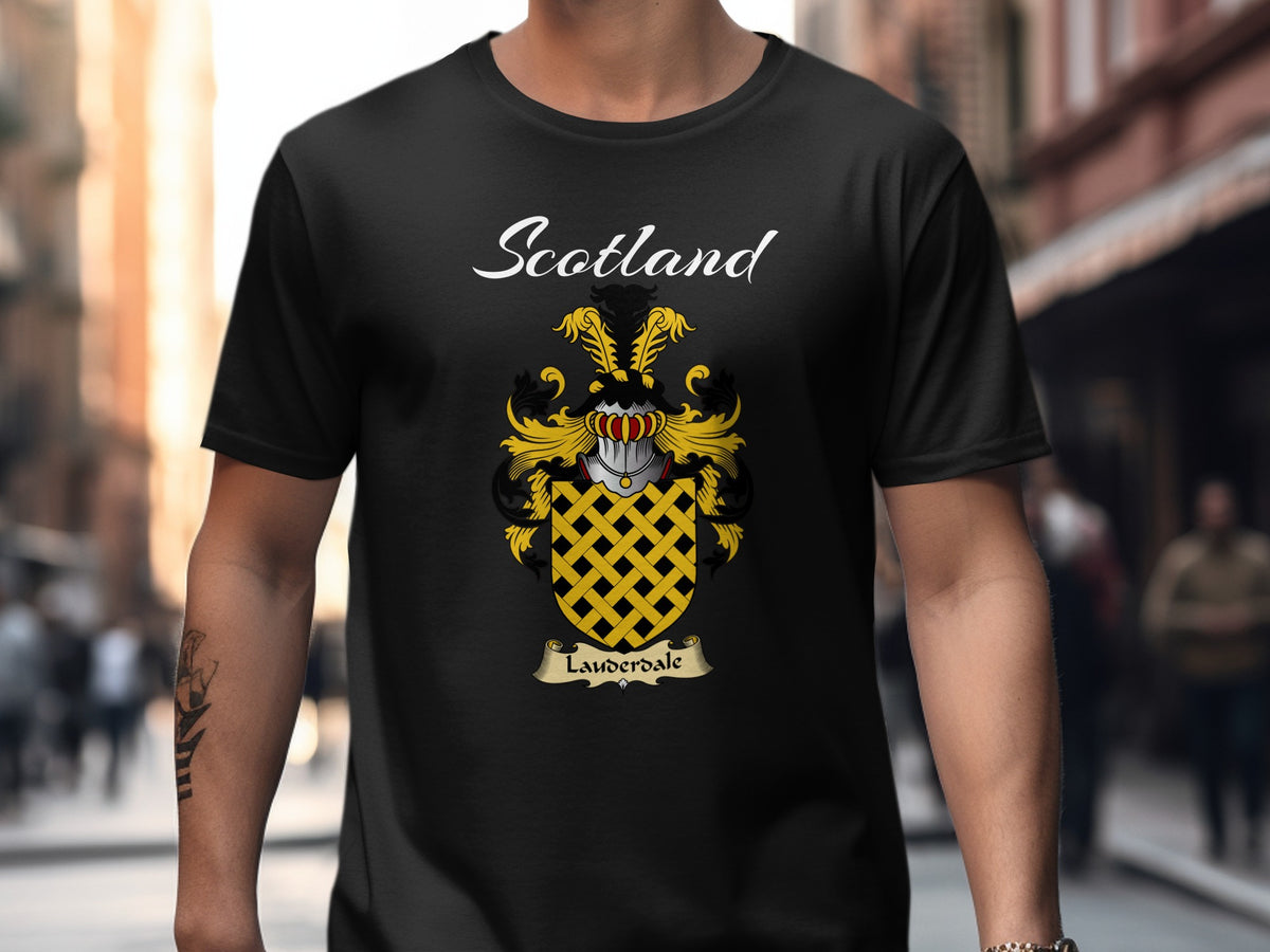 Model wearing a black Lauderdale T-shirt featuring a gold lattice pattern on a black shield