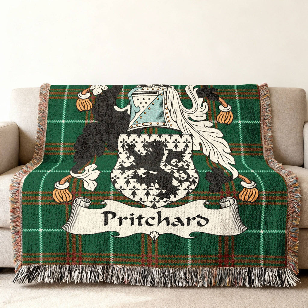 Pritchard family crest on a green plaid woven blanket.