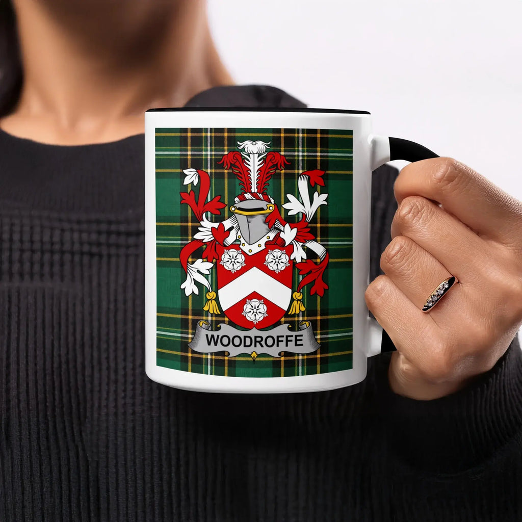 Black mug with Woodroffe family crest on tartan background.