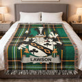 Green tartan blanket with Lawson family crest displayed on a bed.