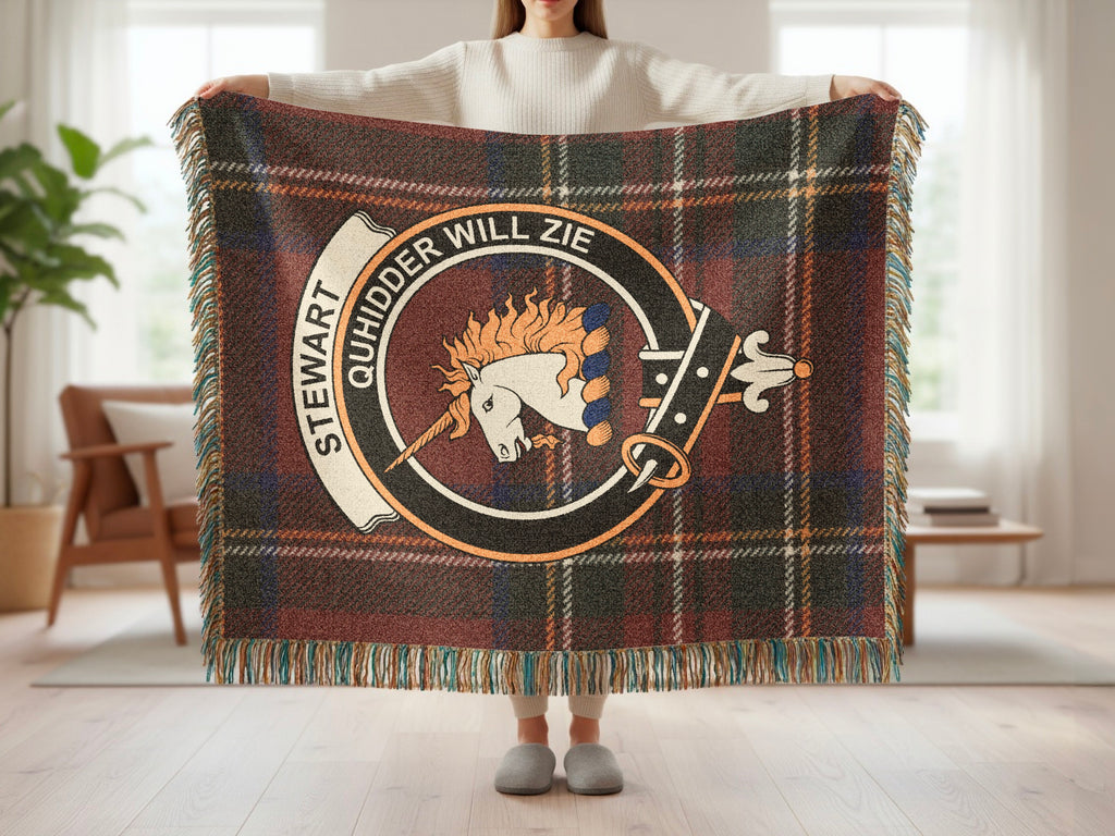 Person holding the Stewart of Appin woven blanket to show the full design, tartan background and fringe