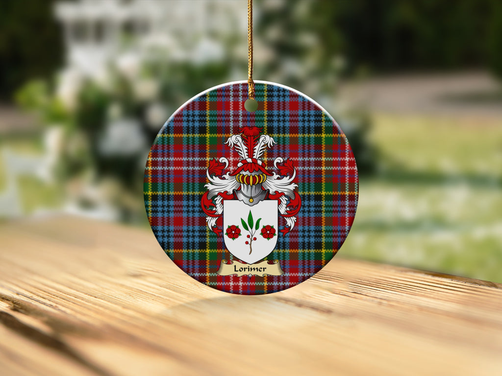 Round Lorimer Scottish clan ornament with family crest on a Caledonia tartan background