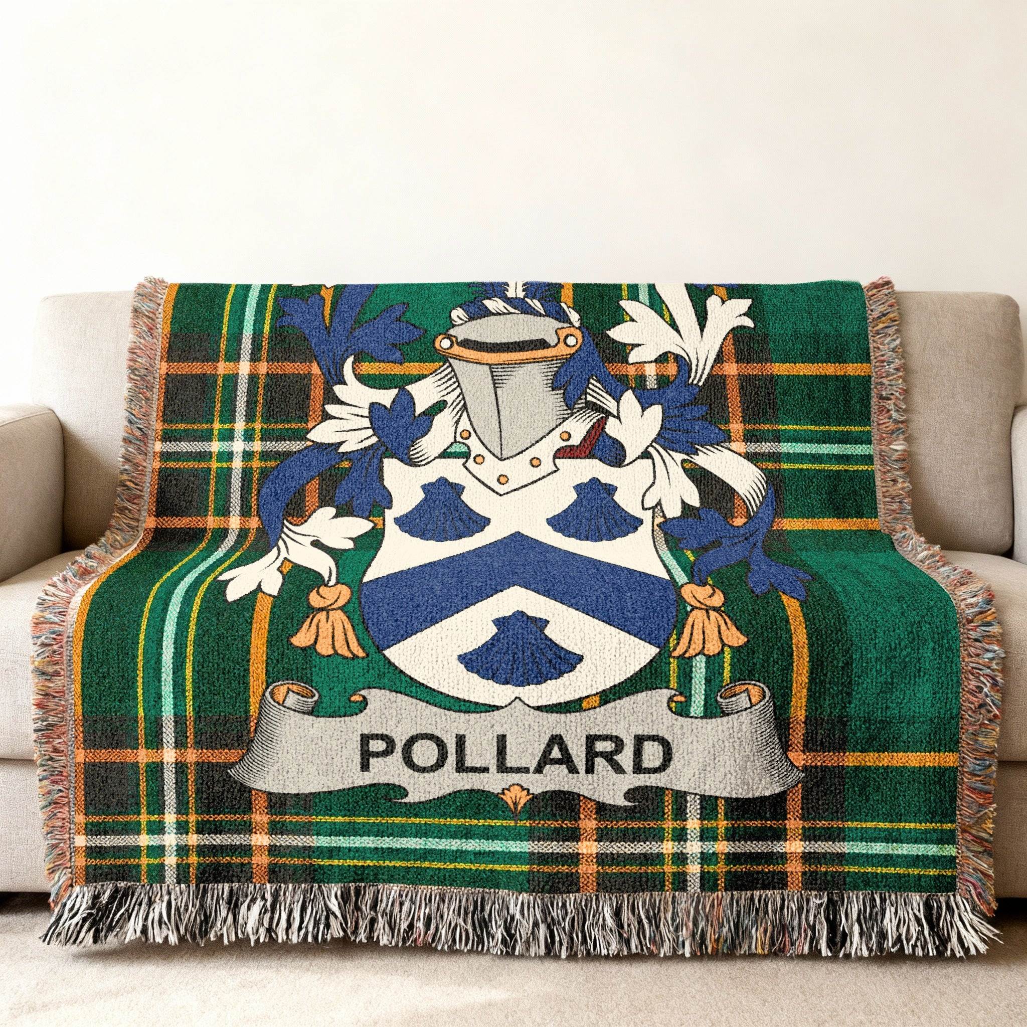 Pollard family crest on a tartan plaid throw blanket on a sofa.