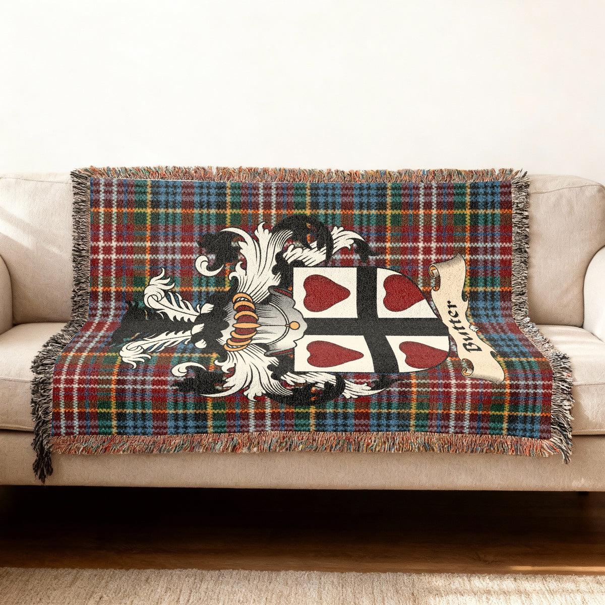 Butter Scottish woven blanket with family shield and Caledonia tartan background