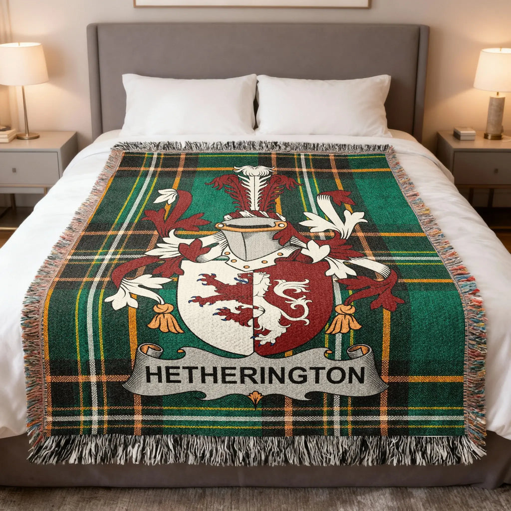 Tartan blanket with Hetherington coat of arms draped on a bed.