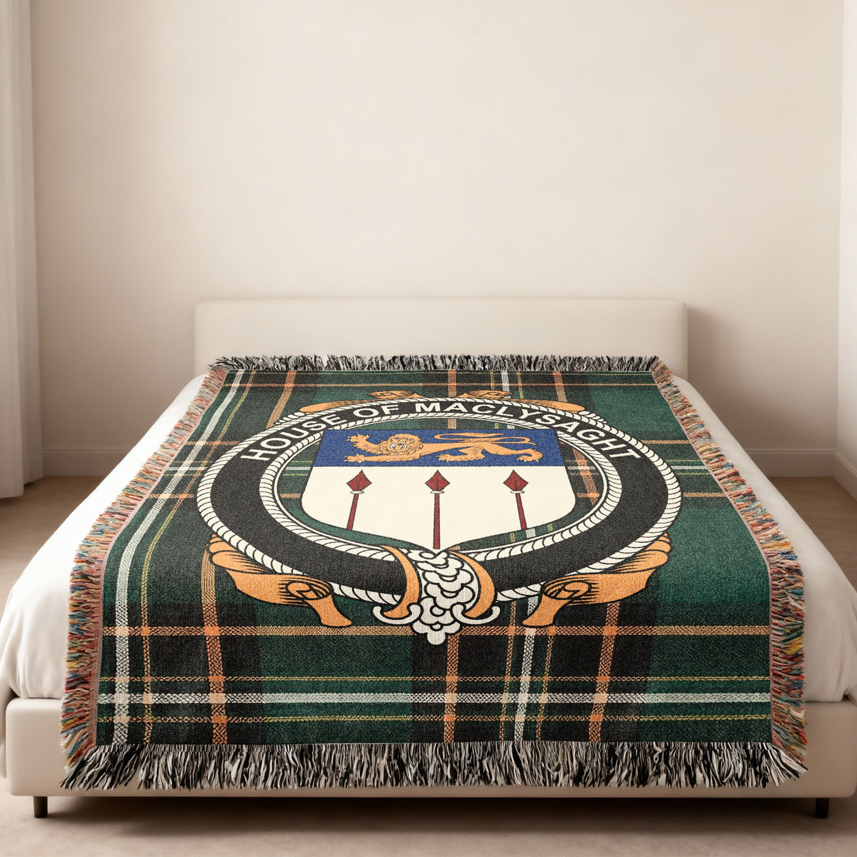 MacLysaght family crest emblem woven blanket displayed on a bed
