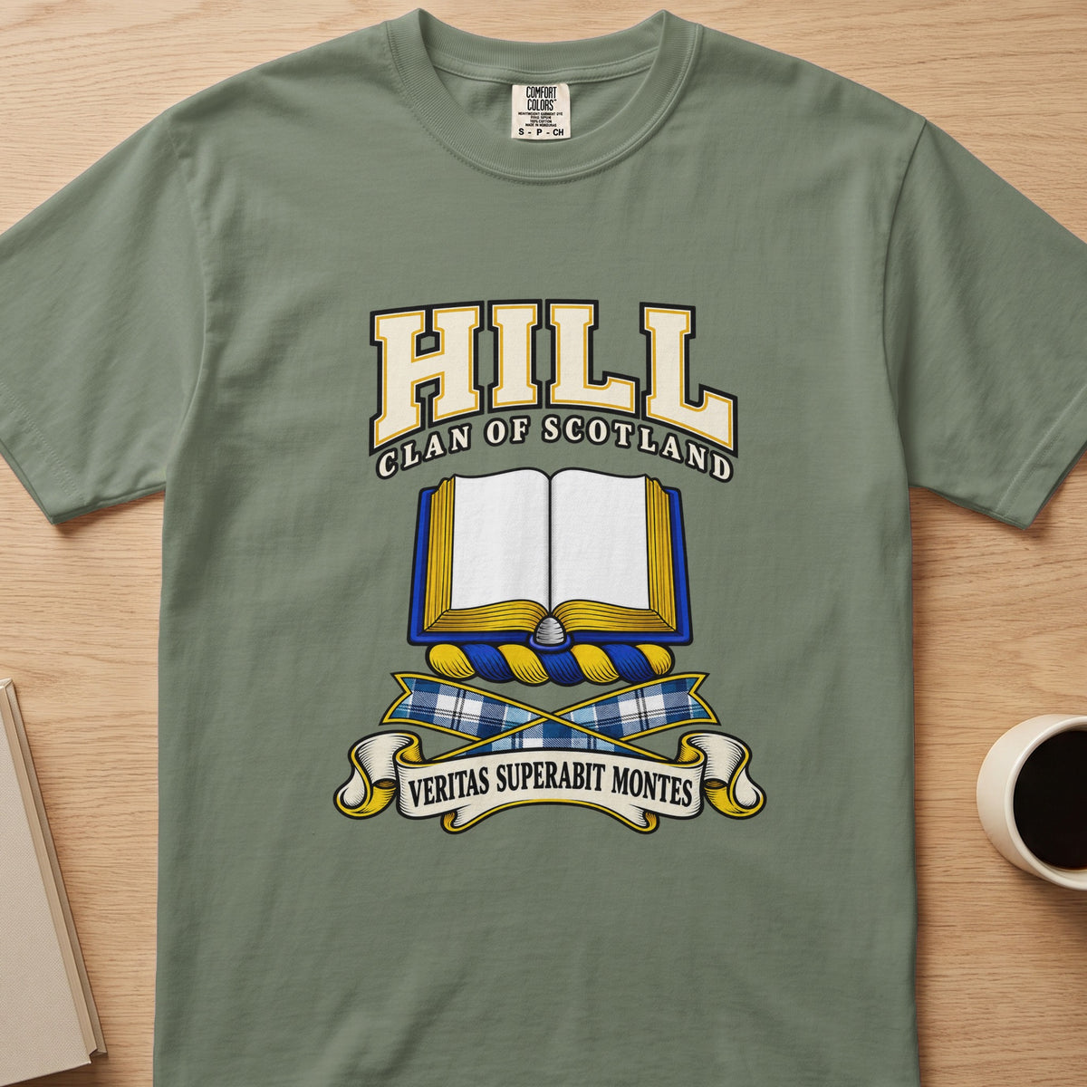 Hill clan T-shirt in sage green, front view with open book with blue and gold edging