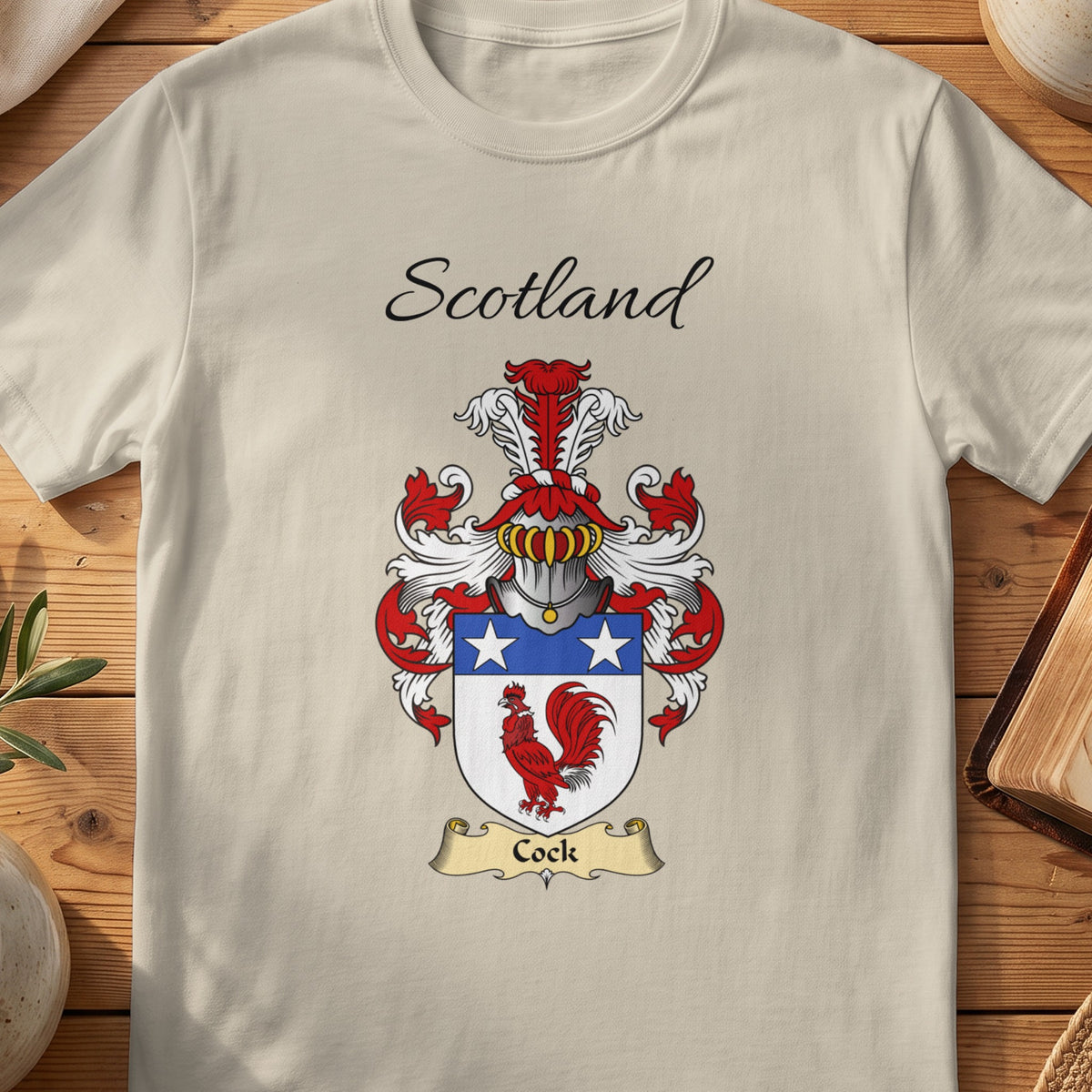 Sand Cock Scottish family shield T-shirt featuring a red cockerel beneath white stars on blue