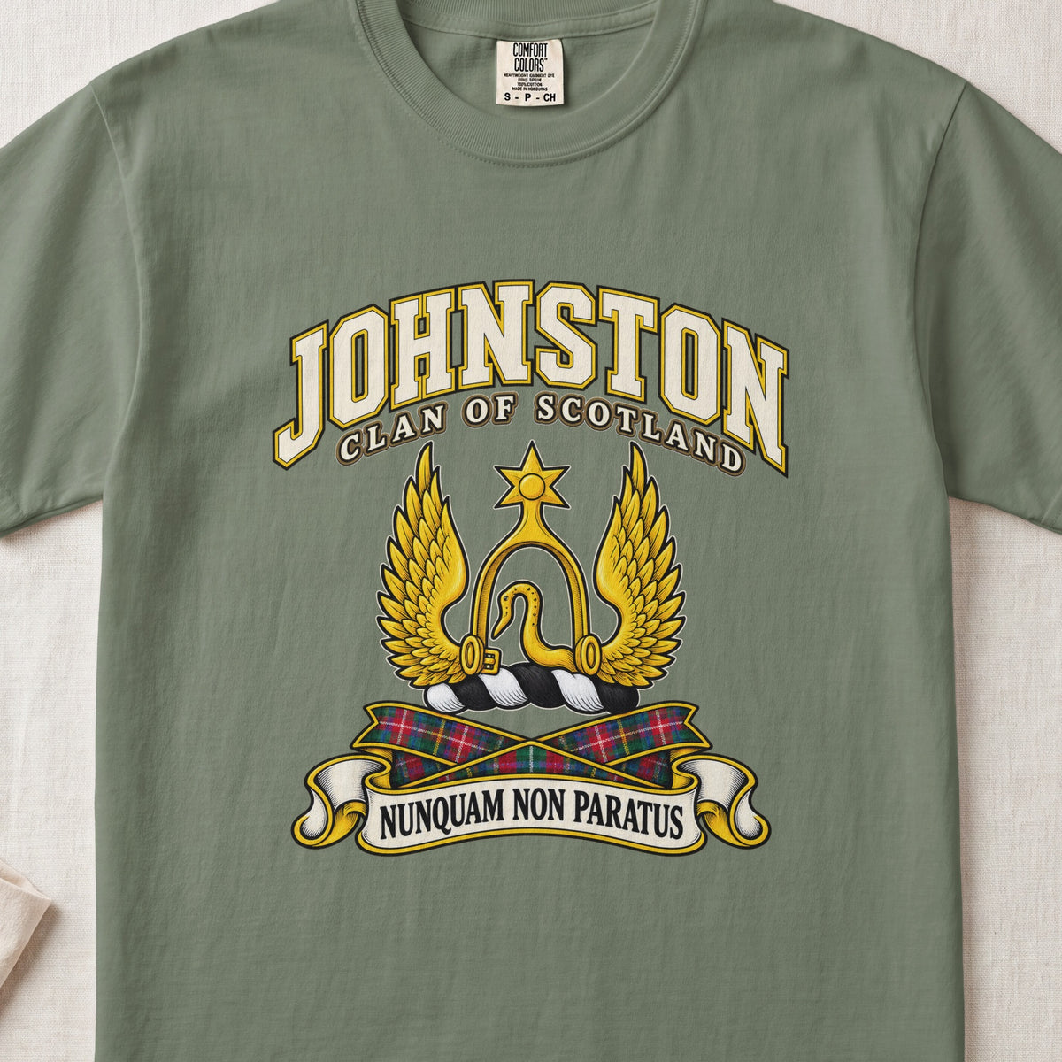 Johnston Scottish clan T-shirt in Moss, front view with a golden winged emblem beneath a star and motto banner.