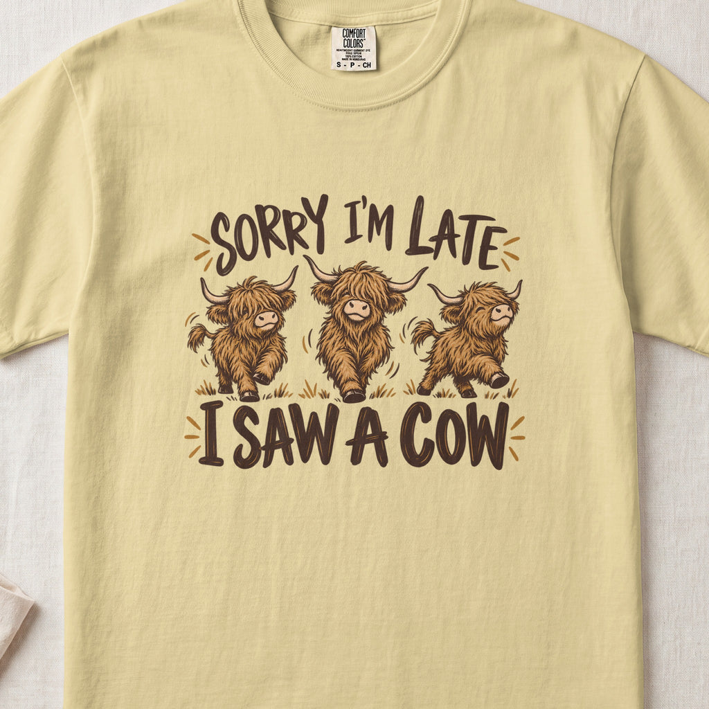 Sorry I'm Late, I Saw a Cow Highland cow design on a Butter Comfort Colors 1717 T-shirt, flat lay