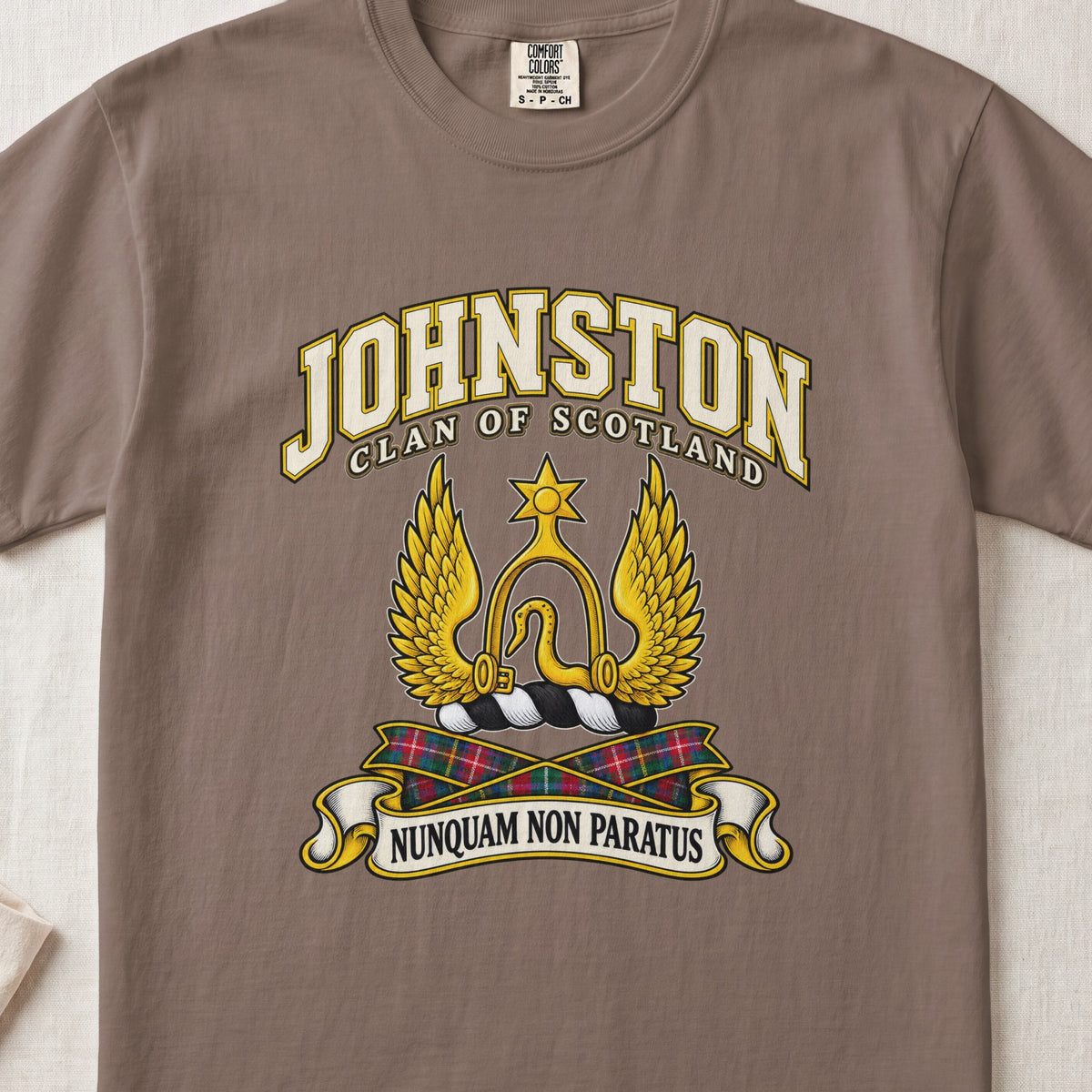 Johnston Scottish clan T-shirt in Espresso, front view with a golden winged emblem beneath a star and motto banner.