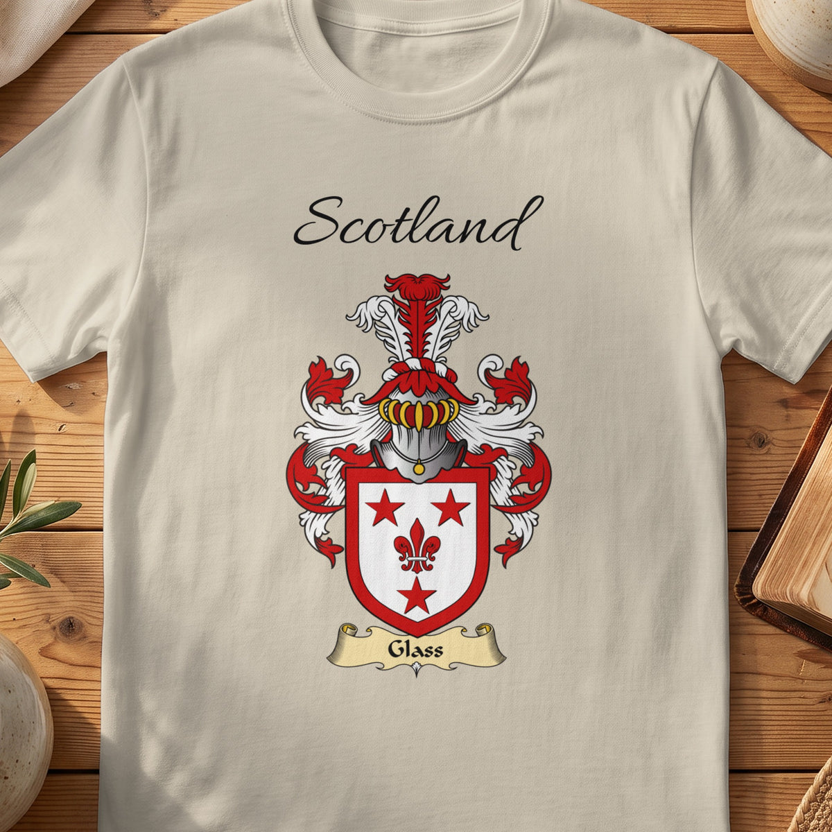 Sand Glass Scottish family shield T-shirt featuring red stars and a fleur-de-lis on white