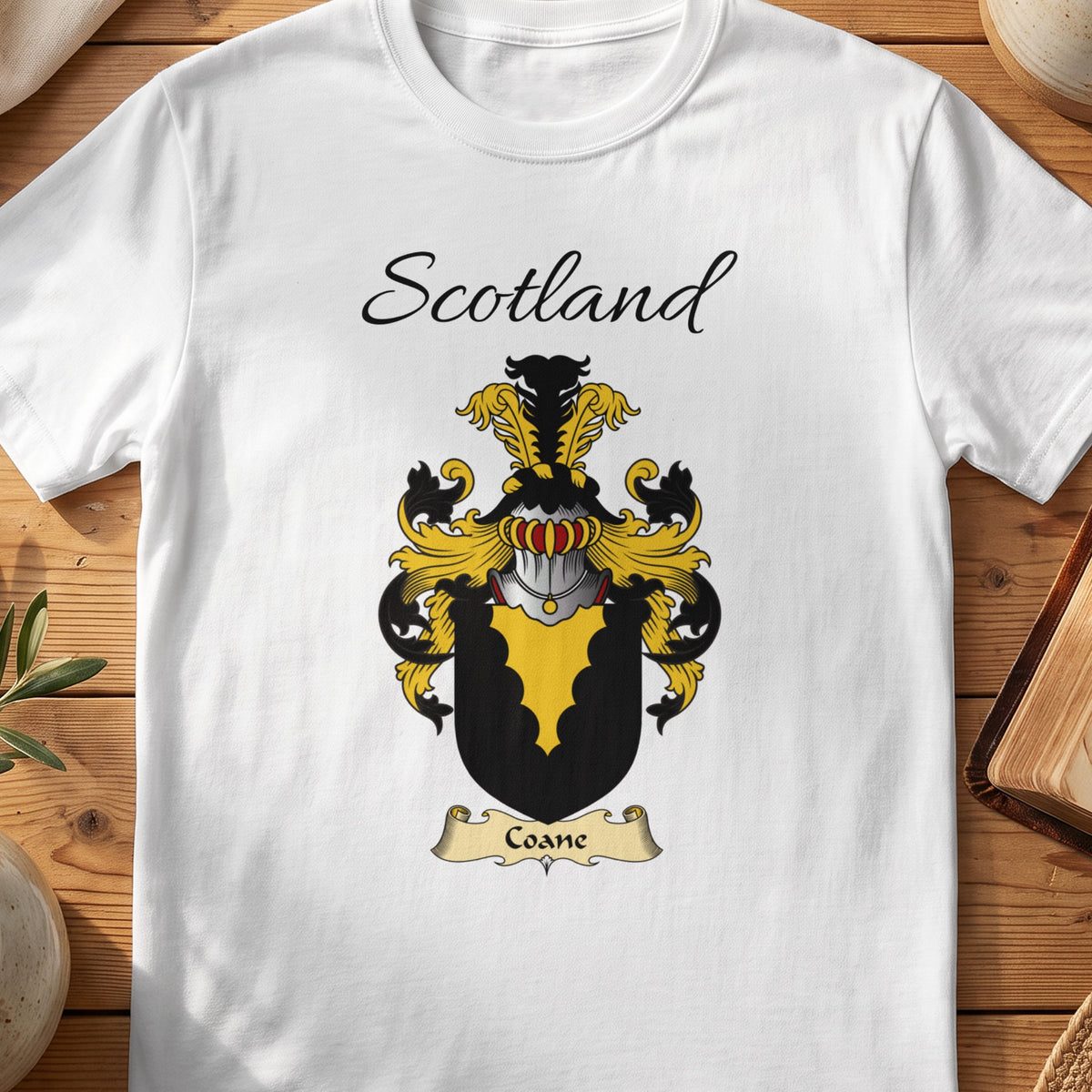 White Coane Scottish family shield T-shirt featuring a gold scalloped wedge on black