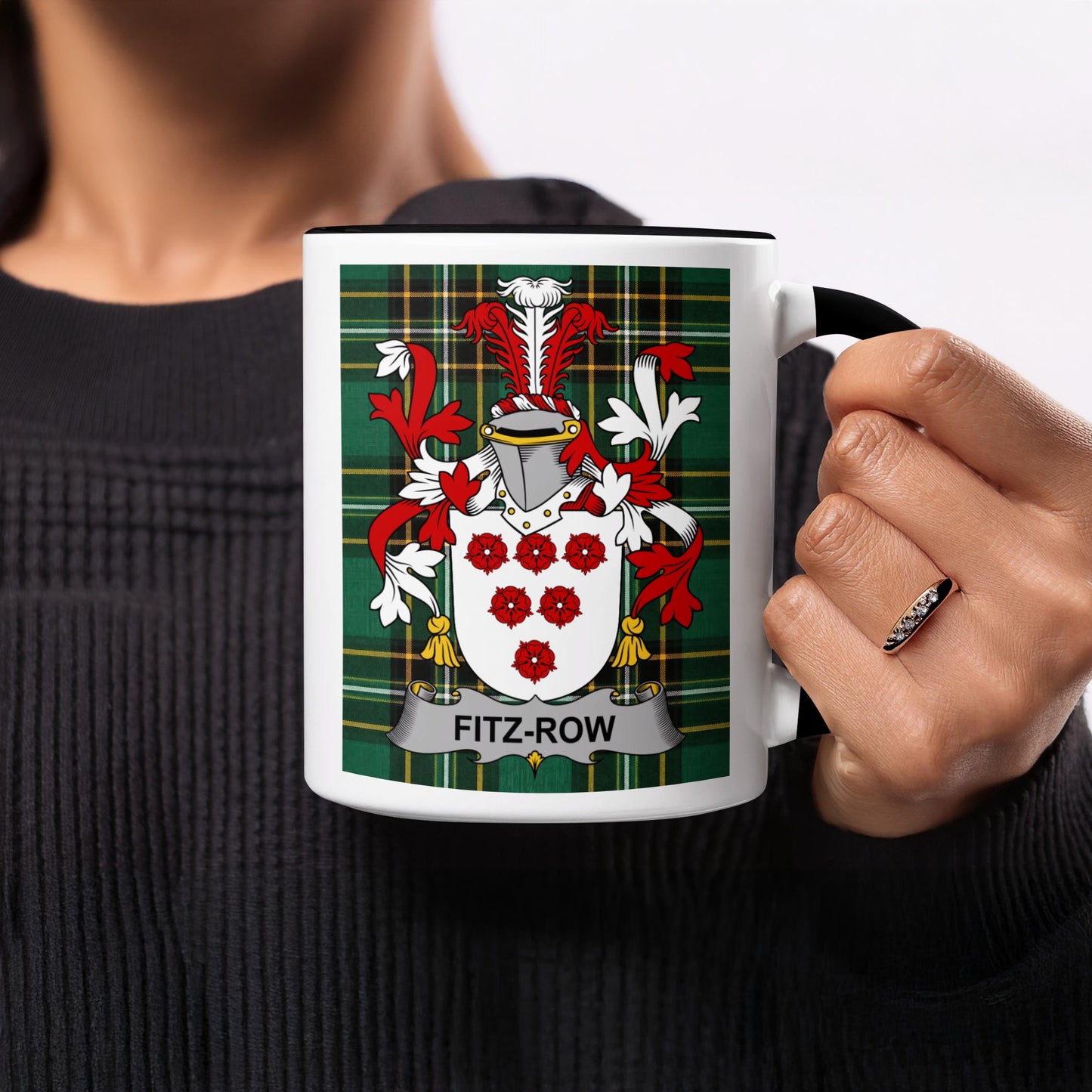 Black mug with Fitz-Row coat of arms on plaid background.