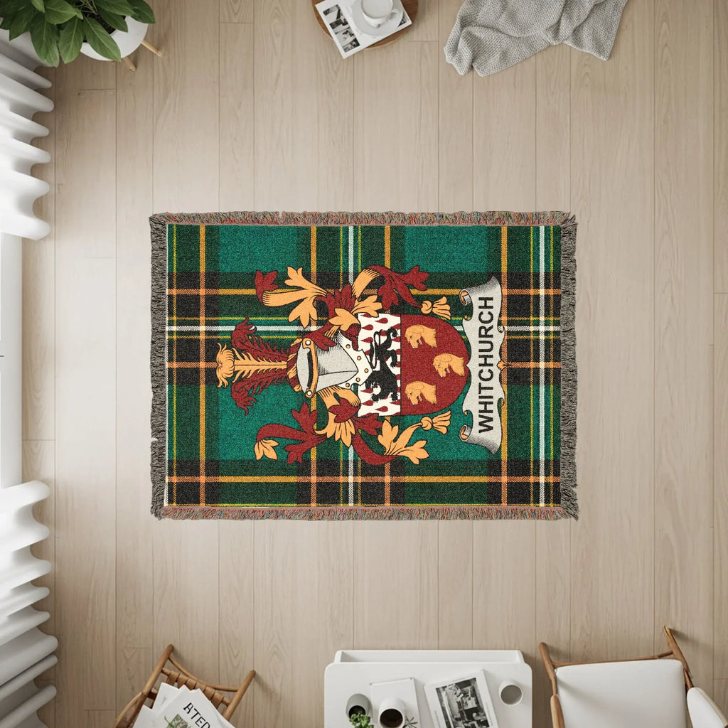 Green plaid woven rug with Whitchurch coat of arms.
