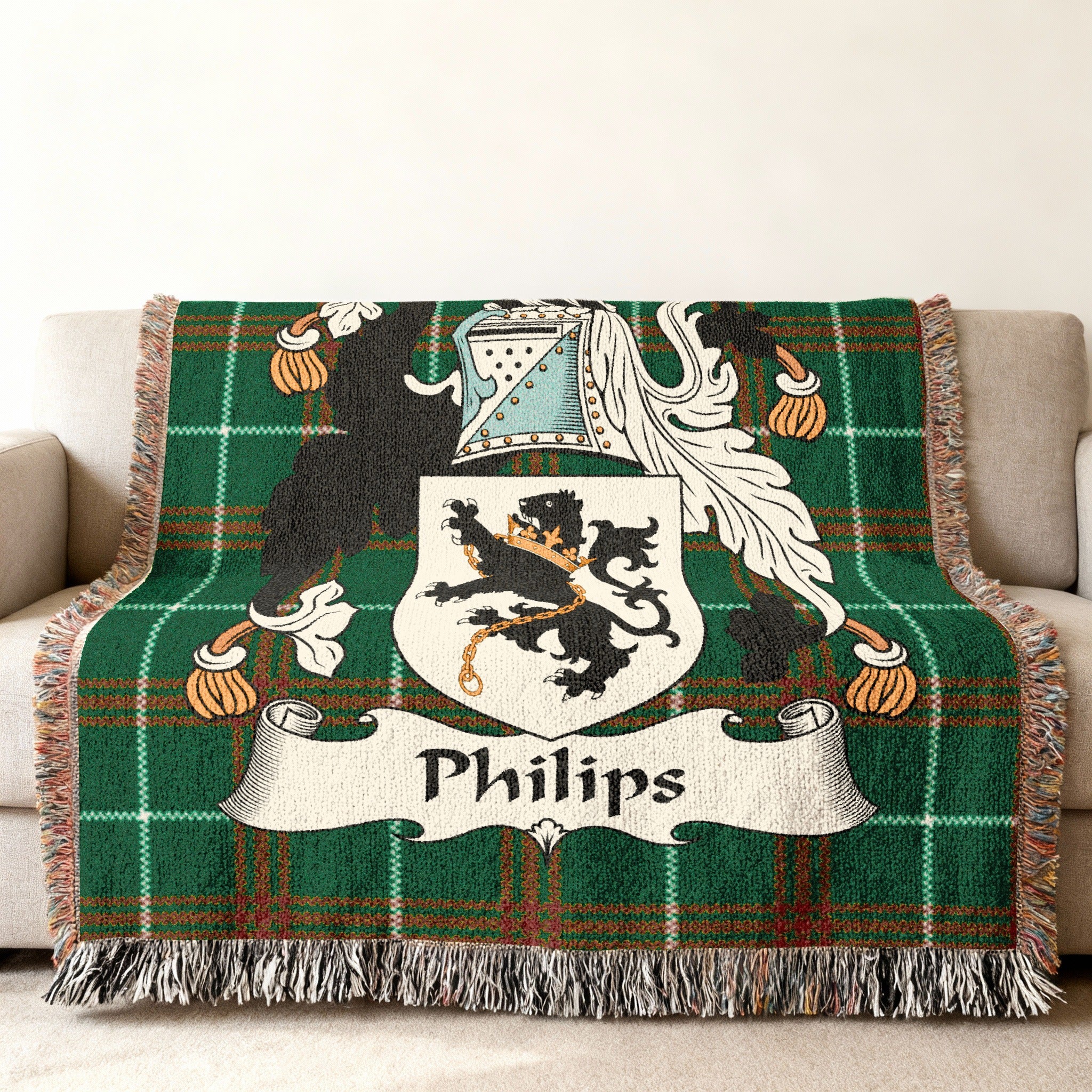 Green plaid throw blanket with the Philips family crest.