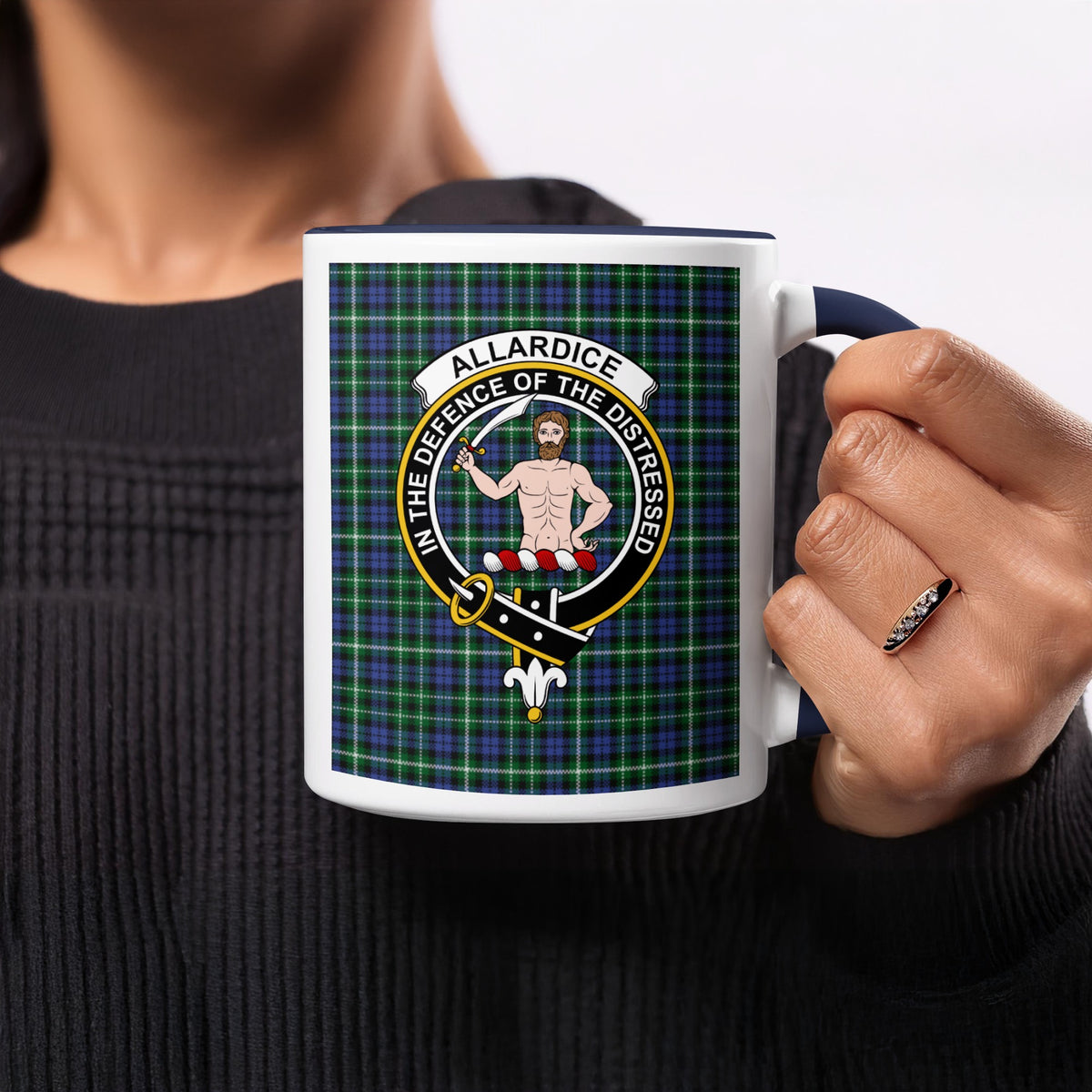 Close-up lifestyle view of Allardice Scottish family crest artwork on a navy 11 oz accent mug with a tartan background