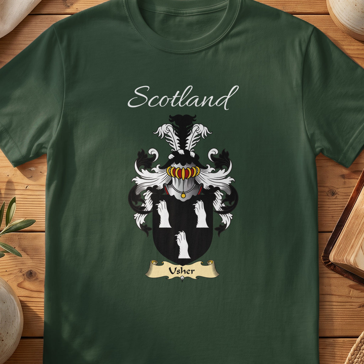 Forest Green Usher Scottish T-shirt laid flat with coat of arms artwork and “Scotland” text.