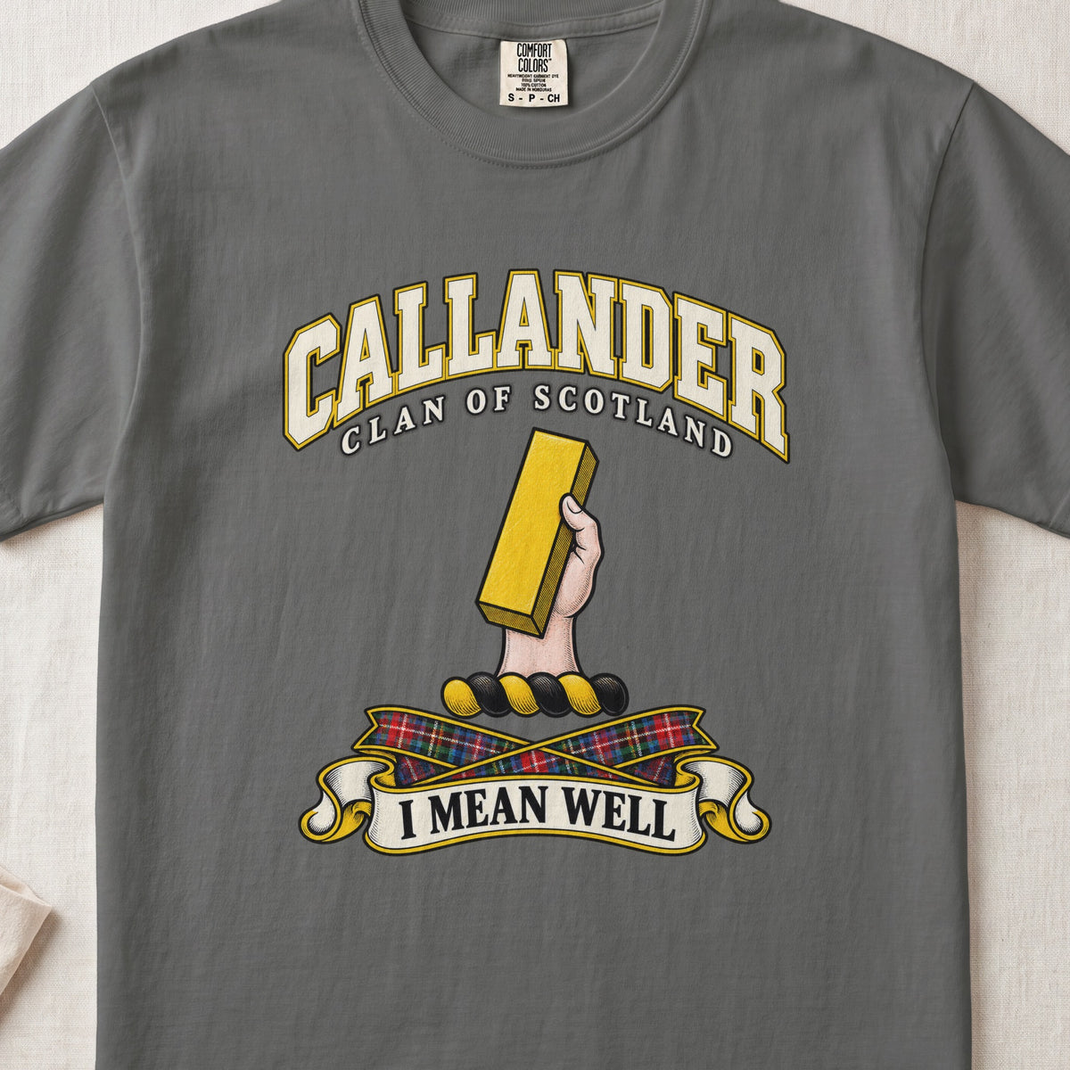Callander Scottish clan T-shirt in Pepper, front view with a hand holding a gold rectangular bar and motto design.