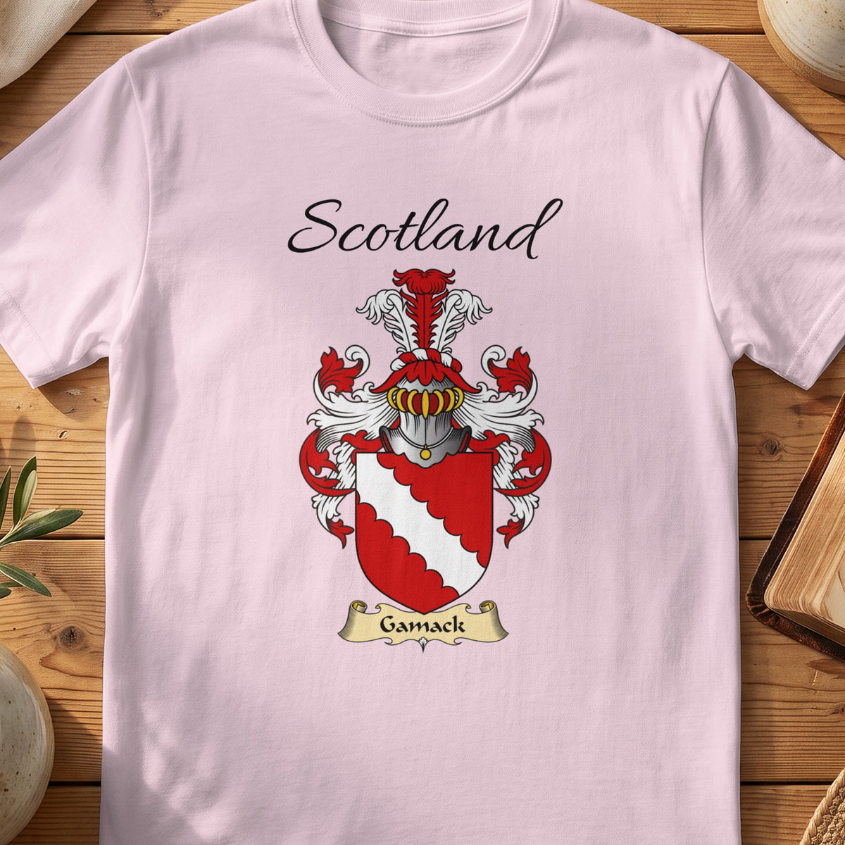 Light Pink Gamack Scottish family shield T-shirt featuring a white scalloped diagonal band on red