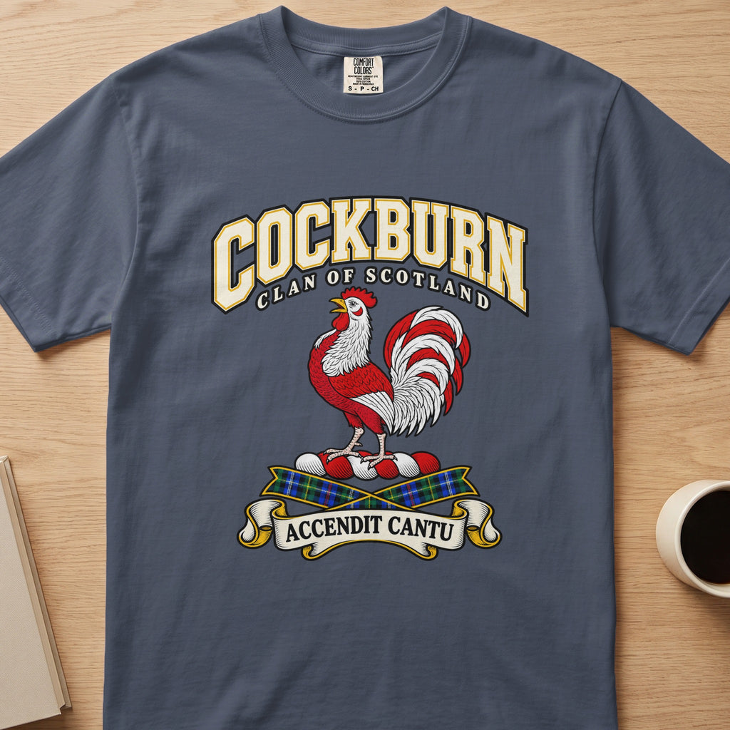Cockburn red-and-white rooster crest graphic on a slate blue Comfort Colors T-shirt, front view